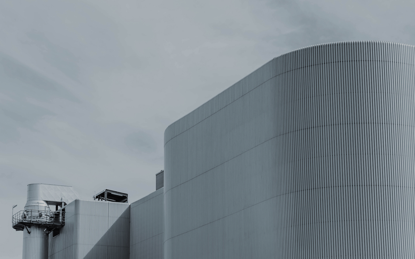 white concrete building under white sky during daytime