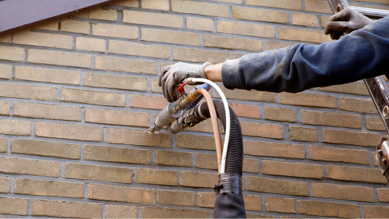 Blow in pipe in brick wall