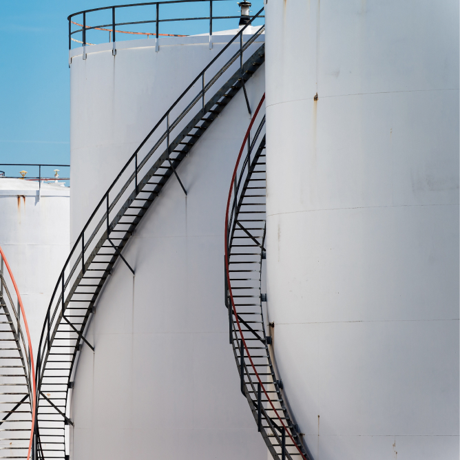 White Oil Tanks Under the Blue Sky