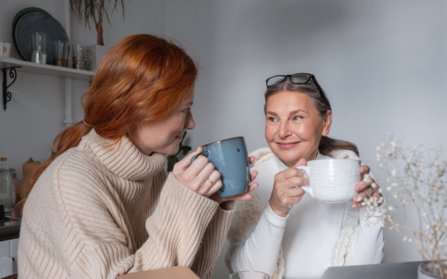 Mom and daughter drinking coffee together