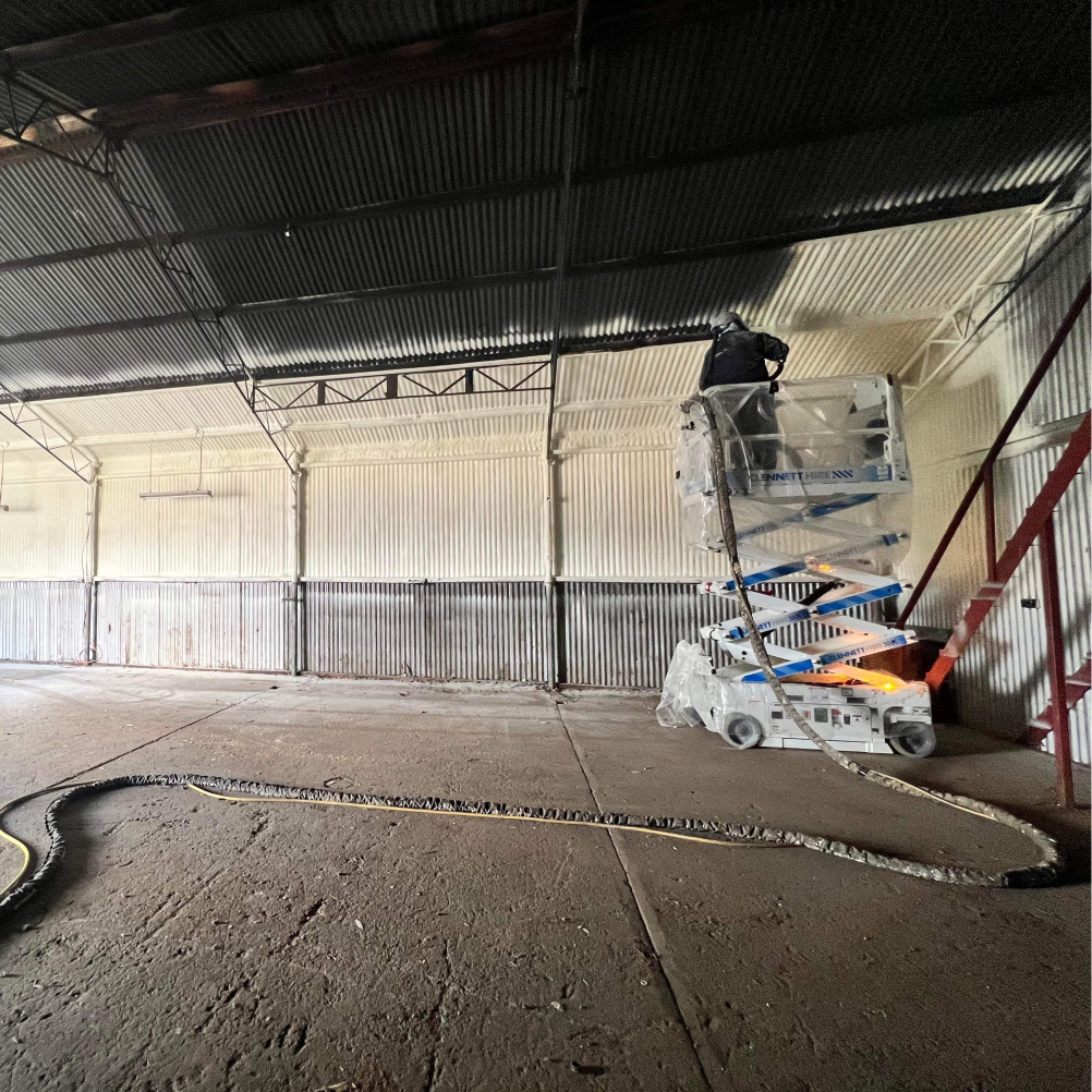 Inside of warehouse being sprayed