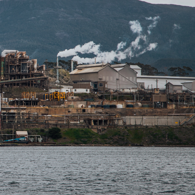 Photo of factories over water